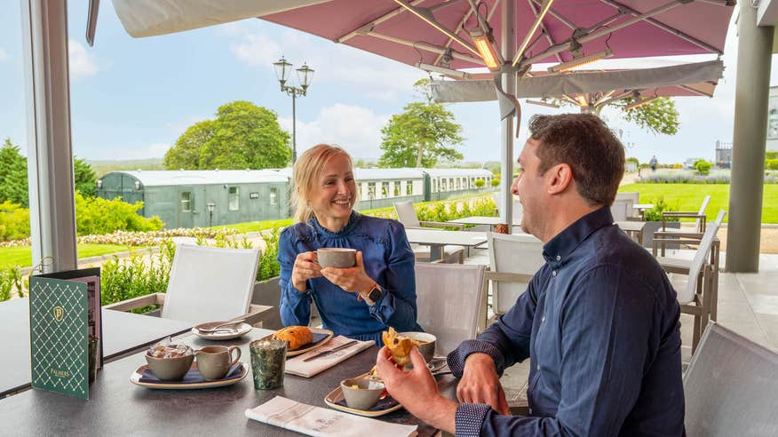 A couple eating at Glenlo Abbey Hotel and Estate in Co Galway